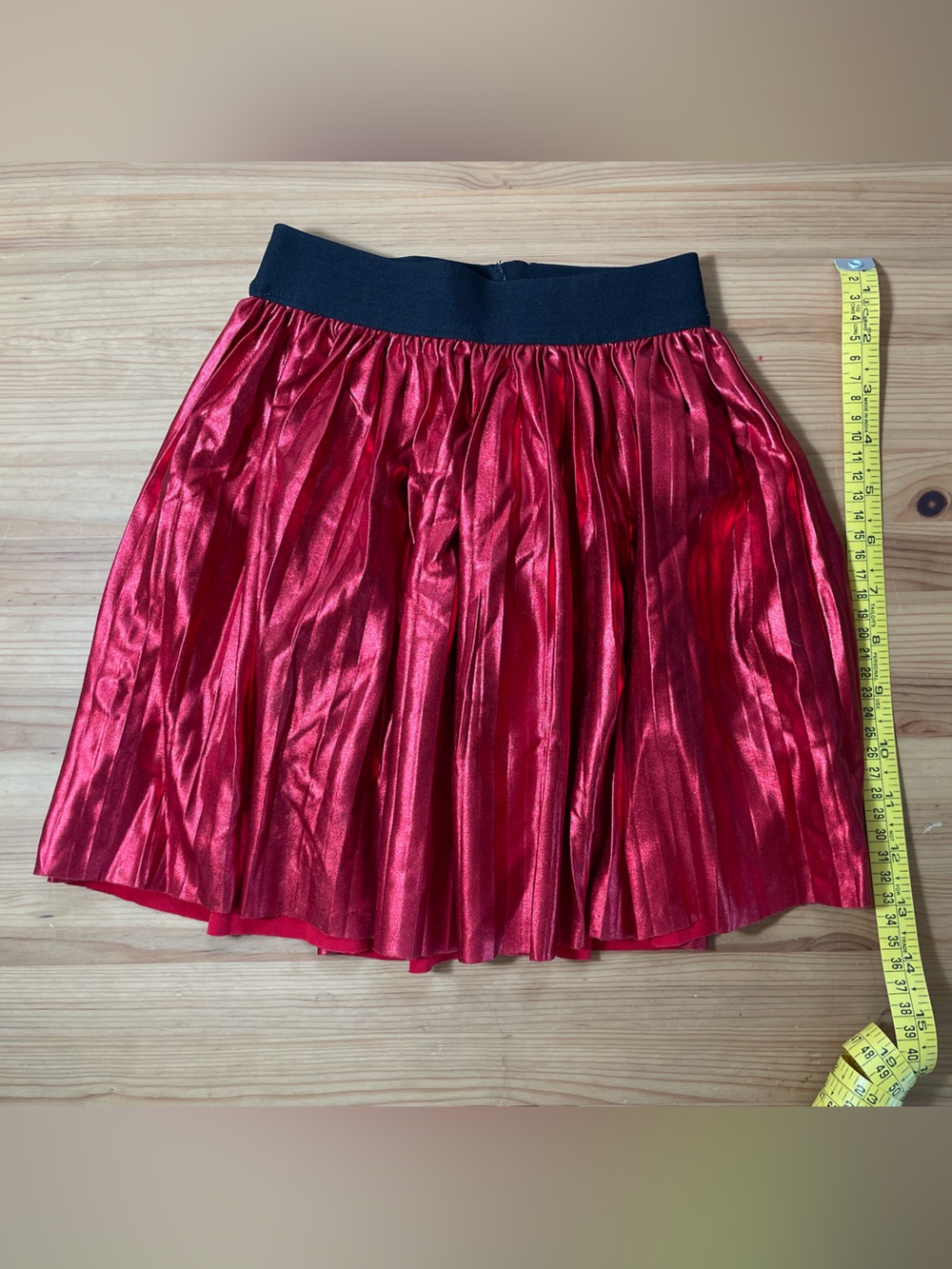 Wonderfully shiny red pleated skirt